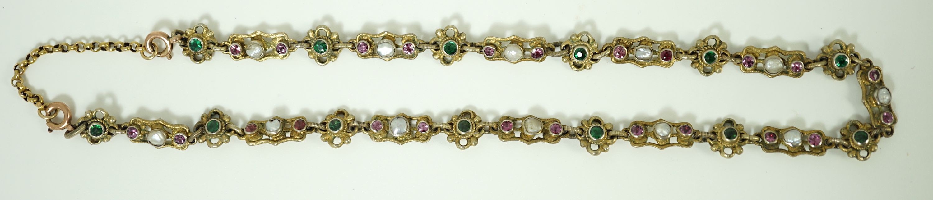 An early 20th century pierced and engraved silver gilt and gem set choker necklace, in the Suffragette colours